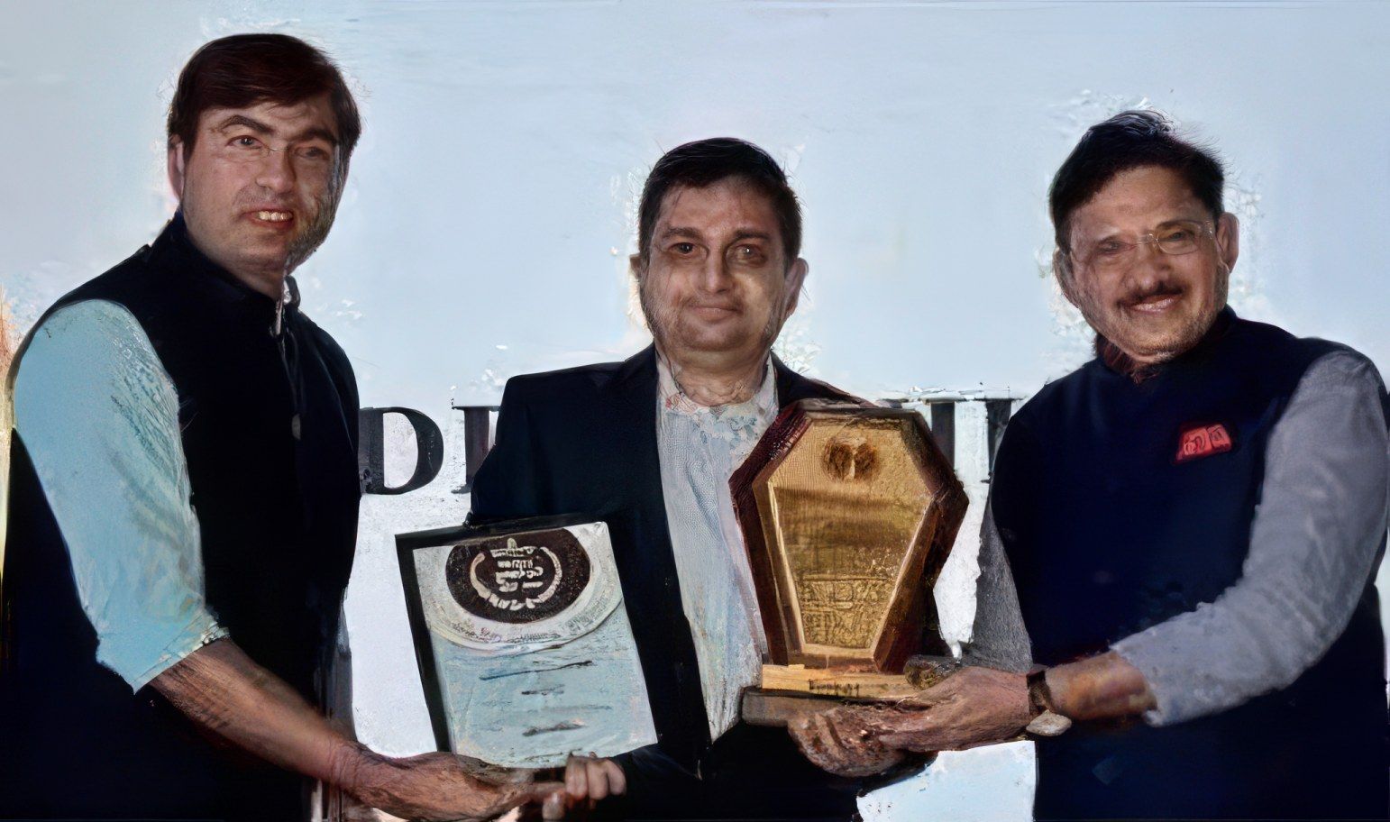 Dr. Sunildatt P. Daru (centre) is honoured for his work in healthcare